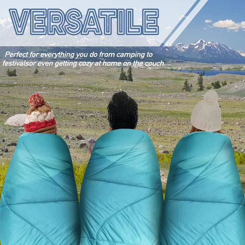 Three people in green Outdoor Puffy Camping Blanket With Lightweight Down Alternative Fill enjoying a scenic landscape.