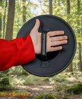 Old School Medieval Steel Buckler Shield Handcrafted With Wooden Grip, 16 Gauge, 30 Cm Round Shield held in forest.