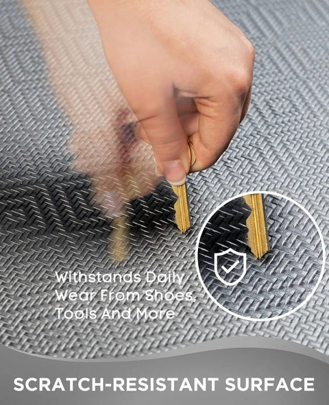 Close-up of durable scratch-resistant surface of ergonomic anti fatigue mat for kitchen and office with key test.