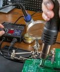 All In One Pro Grade Soldering Iron Station And Hot Air Rework System With Precision Temperature Control in use on circuit board