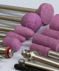 Rotary tool pink cylindrical abrasive grinding stones on metal shanks, set of multiple