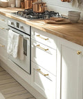 10 Pack Champagne Bronze Cabinet Pulls 5 Inch 128mm Modern Drawer Handles installed on white kitchen cabinets with wood countertop.