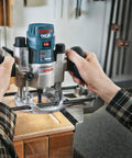 Person using a Six Piece Universal Groove Cutter Router Bit Set With Carbide Tips for precise finishing on wood corner