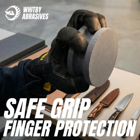 Person holding 4 Inch Dual Grit Pro Grade Axe And Hatchet Sharpener Silicon Carbide Stone with gloves, showing safe grip feature.