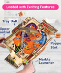 Child assembling DIY Pinball Machine For Kids 8 To 14, Arcade Grade, No Screen STEM Toy That Builds Confidence, Creativity, Fine Motor Skills, And Problem Solving.