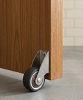 Two Inch Low Profile Door Support Wheels, Anti Sag Caster Rollers For Solid Wood Doors And Gates, heavy duty grey hardware attached to wooden door.