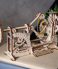 Close-up of assembled Tachometer Model Kit For Adults, Hands On Wooden STEM Puzzle with gears and details.