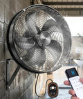 Industrial 16 Inch Indoor Outdoor Wall Mount Fan With Remote Pro Grade Waterproof Oscillating Heavy Duty DC Motor shown in use