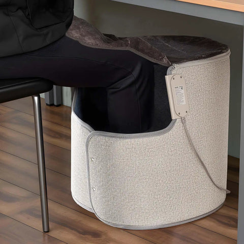 Under Desk Rollable Foot Warmer Pad With Remote in use wrapping around seated person's legs, shown in home office setup.
