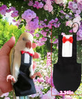 Bird Diaper Harness Tuxedo Flight Suit With Waterproof Inner Layer worn by parrot, showing 5.12in size and black design with red bow.