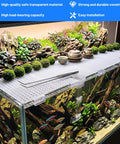 Lock Down 8 Pack Clear Acrylic Aquarium Lid Clips Rock Steady Fish Tank Cover Holders securing a rimless tank with plants and decor.