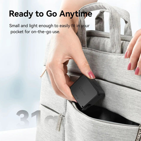 Person placing Dope Mini LED Vlogging Light For Action Cameras With 12 LEDs in gray backpack pocket.