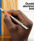 Close-up of hand holding a Detail Craft Knife For Precise Cutting And Fine Detail Work, Exacto Hobby Knife For Arts And Crafts.