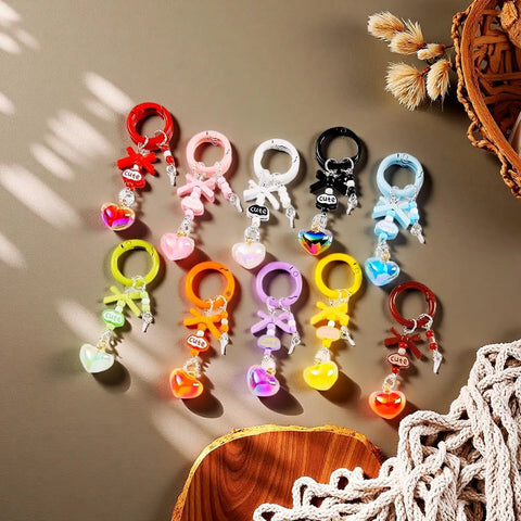 48 Pack Colorful Metal Carabiner Clips For Key Rings And DIY Crafts, Round Snap Hook Keychain Clips arranged with heart charms