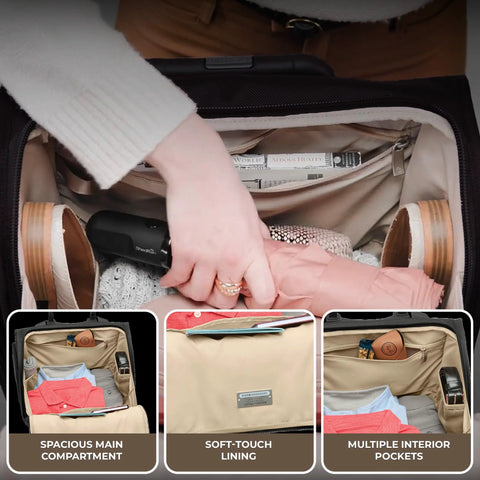 Briggs & Riley Baseline 2-wheel cabin bag in black, open interior with clothes and multiple pockets.