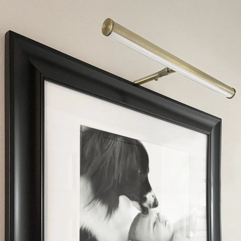 14 Inch LED Picture Light With Integrated LED, 3000K Warm White, 200 Lumens, On Off Switch, Adjustable Decor Wall Light For Indoor Art Displays, Antique Brass Finish mounted on a black frame