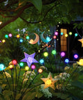 Colorful garden lights shaped like stars and moons among plants for outdoor decor