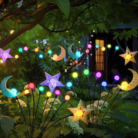 Colorful garden lights shaped like stars and moons among plants for outdoor decor