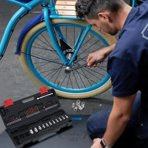 Person using Built To Last 1/4 Inch Torque Wrench Set, 50 Piece Kit With 3-25 Nm Range for bicycle maintenance with kit in foreground