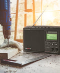 Long Range AM FM Portable Digital Radio With NOAA Weather Alerts And Bluetooth 2 Meter Ham Band Compatibility on workbench