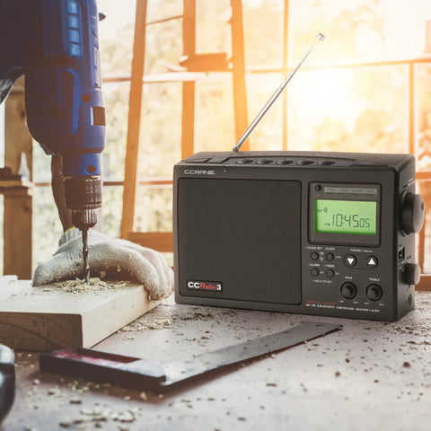Long Range AM FM Portable Digital Radio With NOAA Weather Alerts And Bluetooth 2 Meter Ham Band Compatibility on workbench