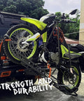 Heavy Duty 2200 Lb Ratchet Tie Down Straps 4 Pack securing a motorcycle on a truck with black 15 ft cargo straps