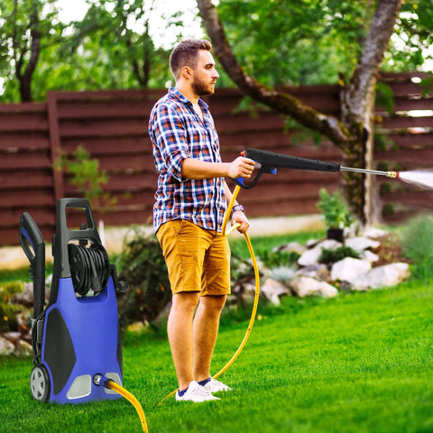 Man using pressure washer with Six Pack Three Quarters Inch Pressure Washer Garden Hose Adapter on lawn