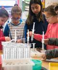 Students using Hands On Hydraulic And Pneumatic Kit With 48 10ml Syringes And 24 Clear 20 Inch Vinyl Tubes for DIY projects.