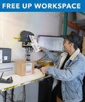Rock Solid Universal Printer Pole Mount With Full Motion Articulating Arm Adjustable Swivel Roll Play Tray Smart Wire Routing For Shipping Desk Workhorse Setup in use at shipping desk with labels.