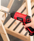 Person using Cordless Electric Screwdriver Kit With Built In LED Light And 31 Pc Bit Set, Rechargeable Battery on wooden structure