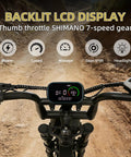 Backlit LCD display on rugged electric bike for adults, 500W brushless motor 48V 18Ah battery, controls shown on off-road path.