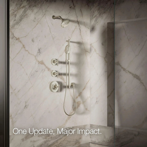Forté Three-Function Showerhead installed in marble shower, showcasing full coverage, pulsating massage and silk spray options.