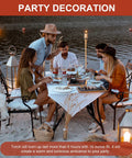 Outdoor dinner with 16oz Torch Replacement Canisters Four Pack Refillable Metal Torch Fuel Cans with wicks on the beach table