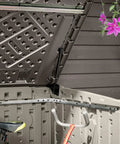 Open Horizontal Outdoor Storage Shed For Trash Cans And Yard Tools All Weather Resin With Soft Close Lid, showing interior space.
