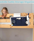 Bedside Caddy Hanging Organizer For Beds And Rails, navy blue canvas with multiple pockets, attached to a bunk bed.