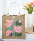DIY Punch Needle Tote Bag Kit For Adults And Beginners With Video Tutorial And Clear Written Instructions Includes Tools For A Unique Pink Green Tote Pattern You Can Craft On The Go showing finished floral design on bag.