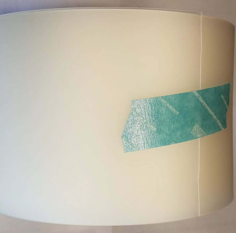 4 Inch By Point Zero One Five Inch By 100 Foot Urethane Die Protection Film roll, for press brake, on a plain background