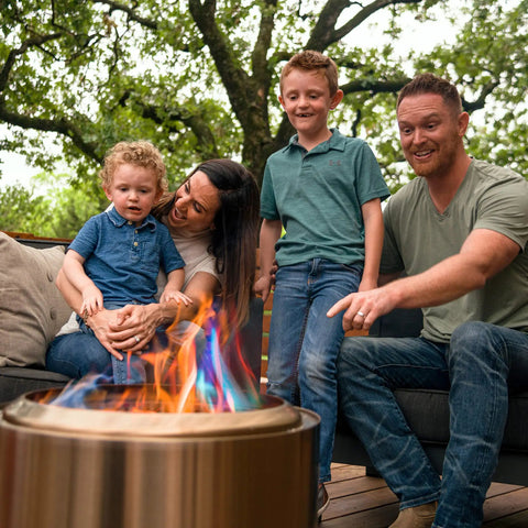 Family enjoying vibrant flames from Color Changing Fire Packets For Fire Pit Ten Pack Of Colorful Flames For Outdoor Pits
