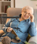 Woman knitting under Electra Floor Lamp With Adjustable Color Temperature From Bright White To Cool To Warm Modern Black Standing Light