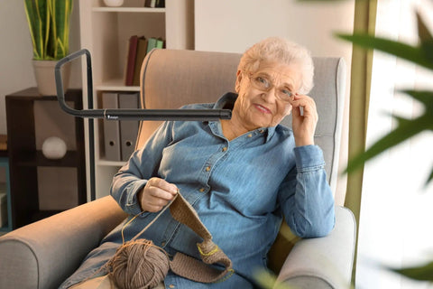 Woman knitting under Electra Floor Lamp With Adjustable Color Temperature From Bright White To Cool To Warm Modern Black Standing Light