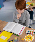 Student reading at desk with Sun Name Tag Stickers 135 Pieces In 9 Cute Designs Perfect For Back To School Classroom Decor