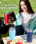 Eight Tough As Nails Twenty Ounce Double Wall Insulated Stainless Steel Tumblers With Secure Lids And Straws That Keep Your Sippin Frosty Or Steaming Hot All Day Long In Sleek Black Finish, shown in use while camping.