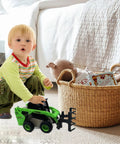 Child playing with Three In One Skid Steer Loader Construction Toys Set One Fifty Scale Diecast Site Loader With Metal Forklift