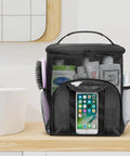 Mesh Shower Caddy Tote For Dorms And Travel on wooden shelf holding toiletries with phone pocket