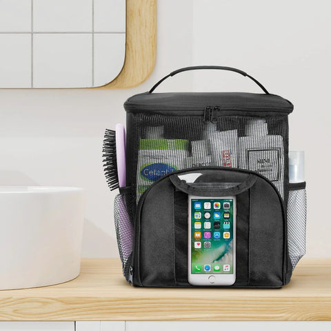 Mesh Shower Caddy Tote For Dorms And Travel on wooden shelf holding toiletries with phone pocket