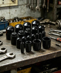 Heavy Duty Black Vinyl End Caps Assortment Kit With 40 Pieces For Multiple Sizes Including Quarter And Half Inch To Protect Furniture Legs And Metal Threads From Scratches While Keeping Your Home Projects Looking Fresh. Black vinyl end caps on a workbench, assorted sizes for furniture legs and threaded rods