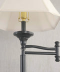 Close-up of Wentworth Swing Arm Floor Lamp In Burnished Bronze Finish with cream shade and extension arm detail.