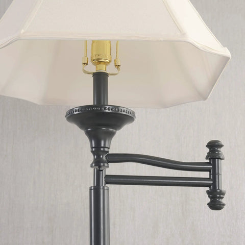 Close-up of Wentworth Swing Arm Floor Lamp In Burnished Bronze Finish with cream shade and extension arm detail.