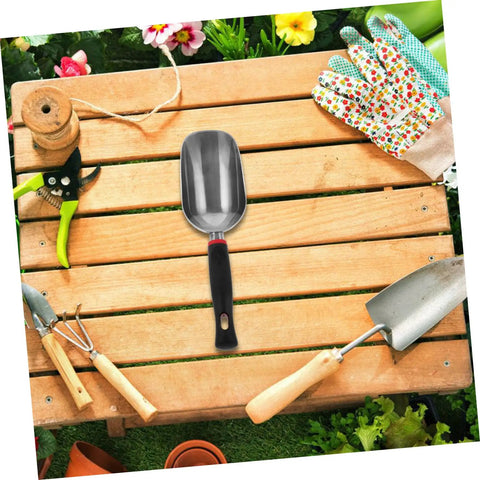 Ergonomic Metal Garden Shovel And Ice Scoop on wooden table surrounded by garden tools and gloves
