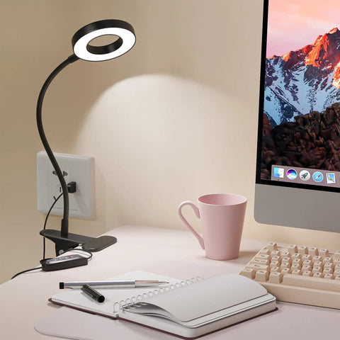 Clip On Led Desk Light With 48 LEDs, USB Powered, Three Color Modes And Ten Brightness Levels Per Mode on a desk by a computer monitor